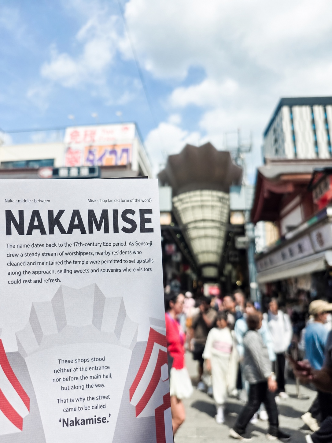 An English SENSO-KION guide held in front of Nakamise Street in Asakusa